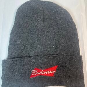This gray Budweiser beanie features a red embroidered logo patch